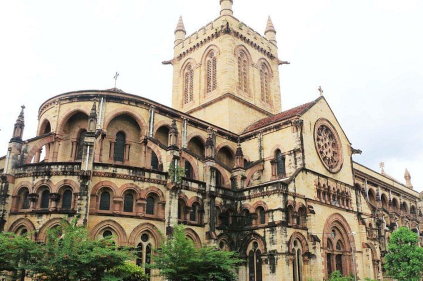 A large, historic church with a prominent bell tower and multiple arches. 4