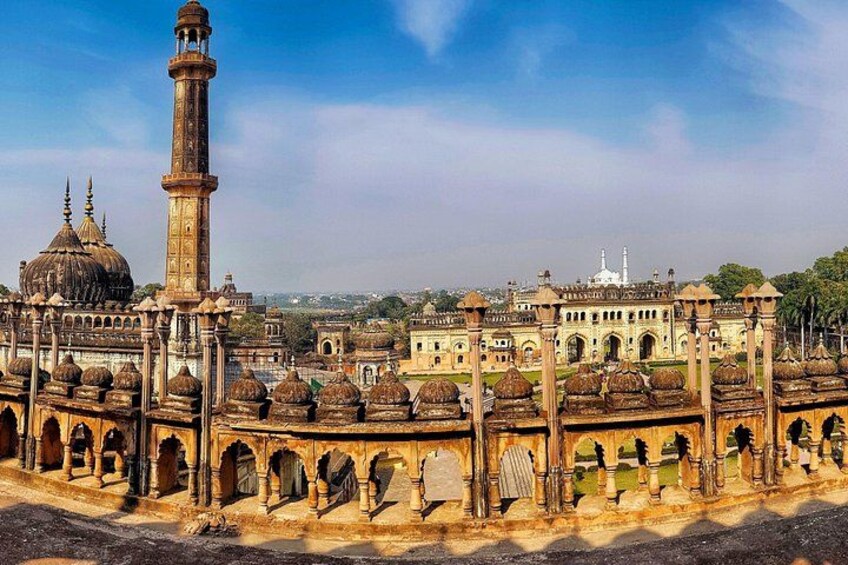 A historic building with domes and a minaret. 4