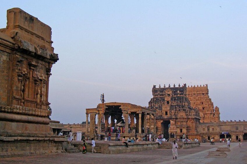 An ancient temple complex with intricate carvings and a large central structure. 1