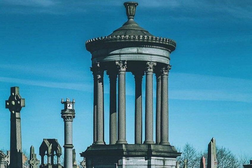 A classical structure with columns and a dome, surrounded by other historical monuments. 4
