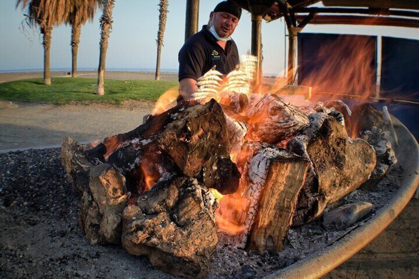 Sardines On Skewers Show Cooking in Malaga beach