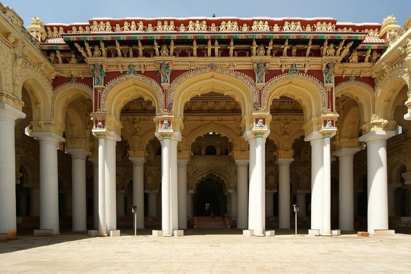 A grand architectural structure with multiple arches and columns, featuring intricate carvings and statues. 4