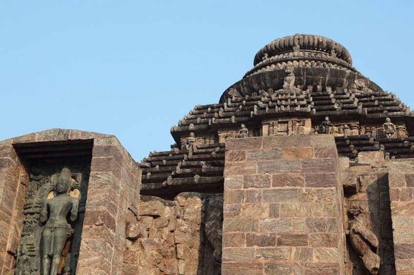 A stone temple with intricate carvings and a large statue. 4