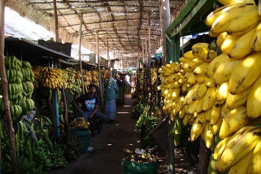 A market with bananas on display. 1