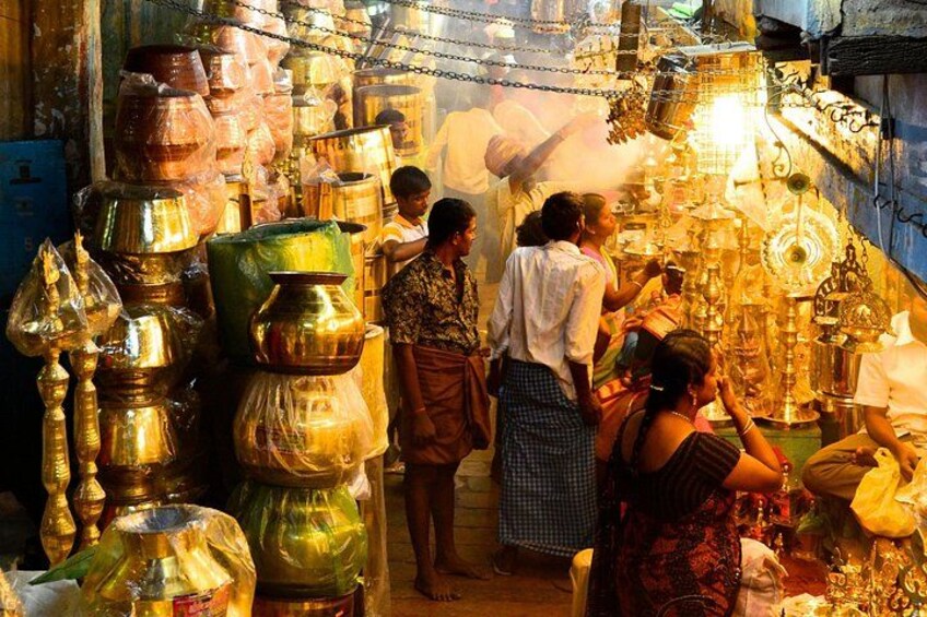 A market with various metal containers and utensils. 4