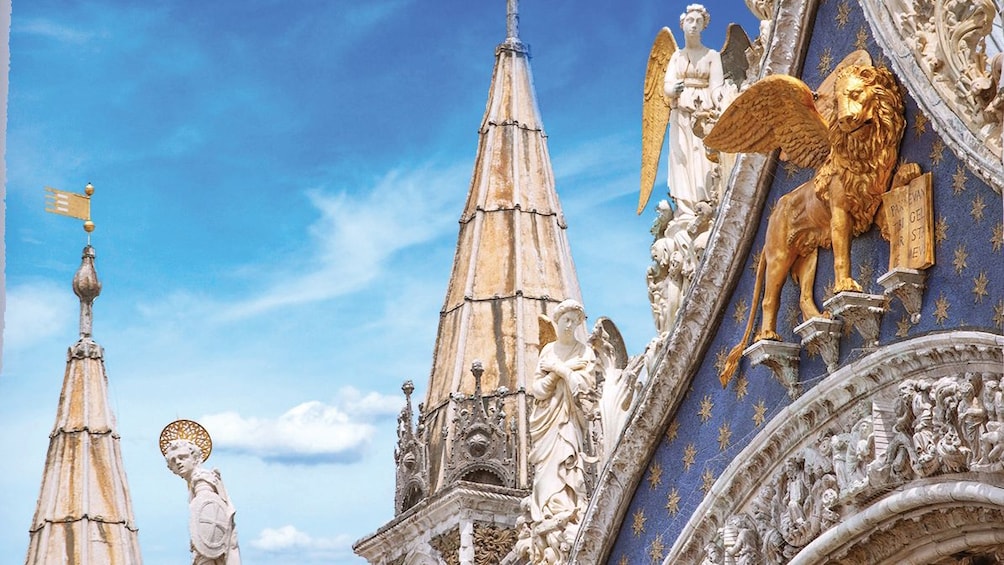 close up on front of building in venice with golden lion 1