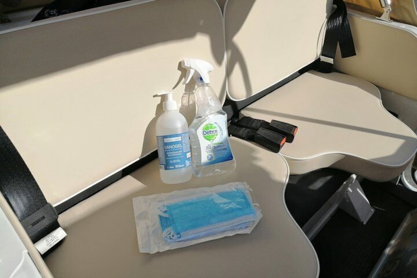 A seat with a bottle of Vanogel, a bottle of Dettol, and a pack of tissues. 4