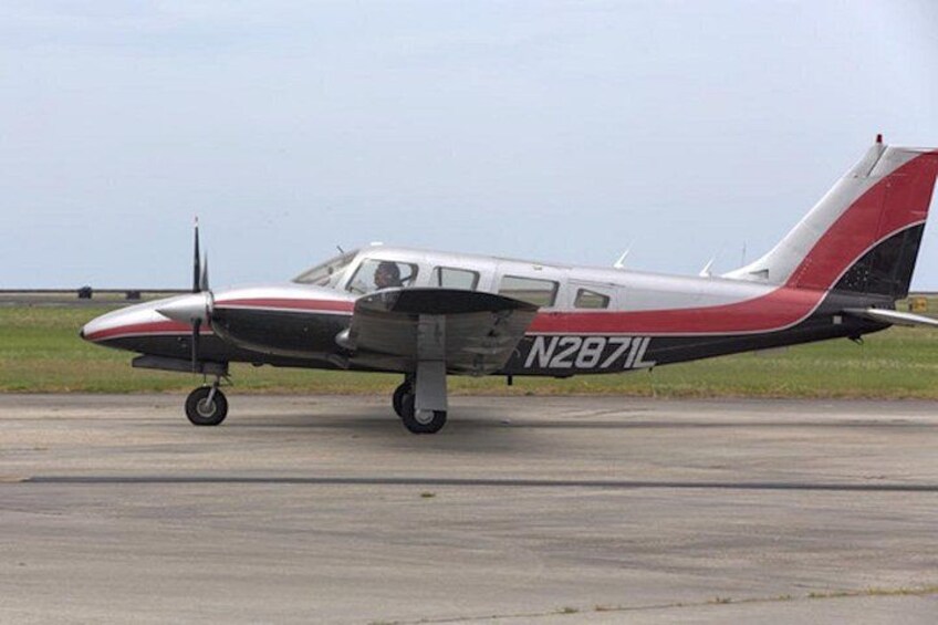 A small aircraft with registration N287IL on a runway. 1