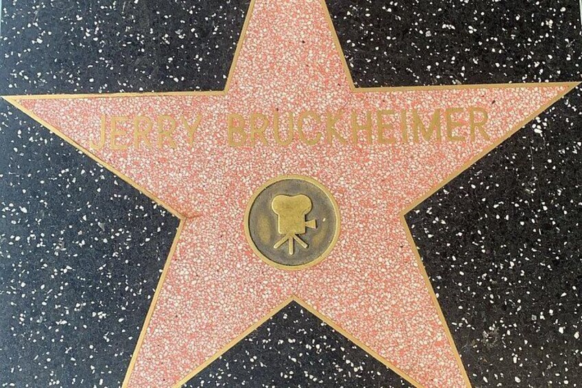A Hollywood Walk of Fame star with the name 'JERRY BRUCKHEIMER' and a film reel icon. 4