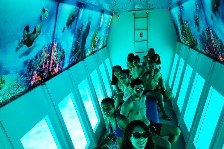A group of people inside a room with large windows and a ladder. 3