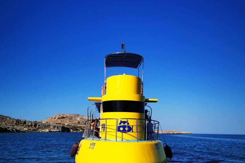 A yellow lighthouse by the sea. 4