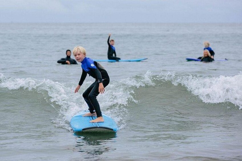 A person surfing on a wave in the ocean. 3