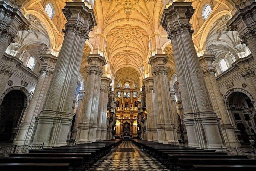 A grand cathedral interior with high ceilings, large columns, and a central altar. 1