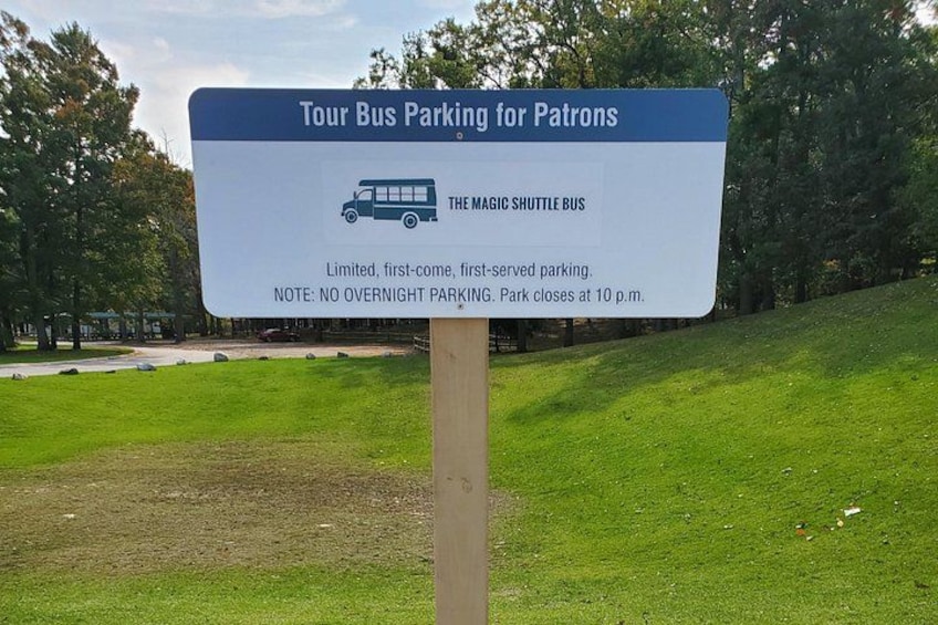 A sign for Tour Bus Parking for Patrons with a Magic Shuttle Bus icon, limited first-come, first-served parking, and a note about no overnight parking and park closing at 10 p.m. 4