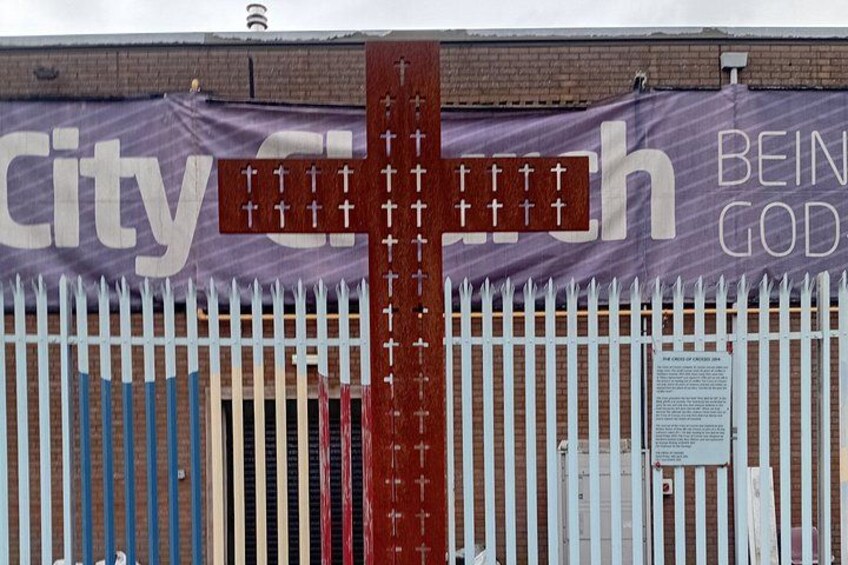 A cross with a banner in the background reading 'City Church' and 'Being God.' 5