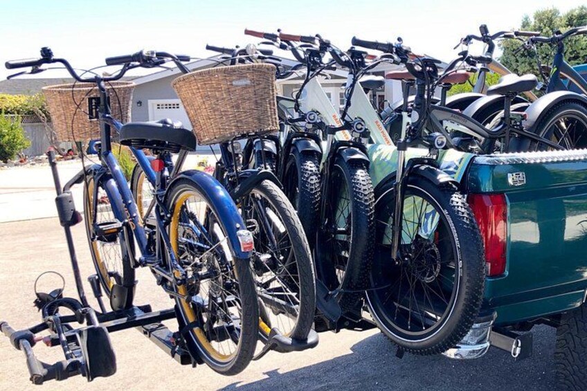 A row of bicycles parked on a trailer. 2