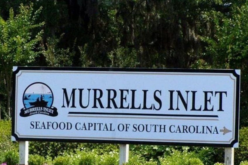 A sign for Murrells Inlet, labeled as the seafood capital of South Carolina. 3