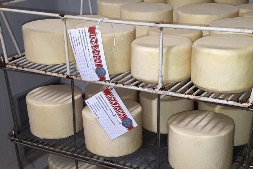 A cheese display with labels. 1