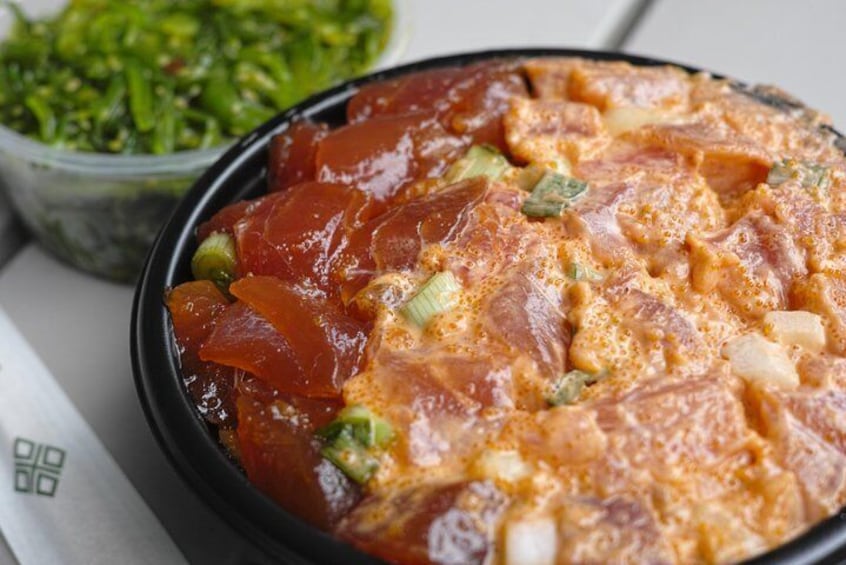 A dish with a creamy sauce, chunks of meat, and vegetables. 1