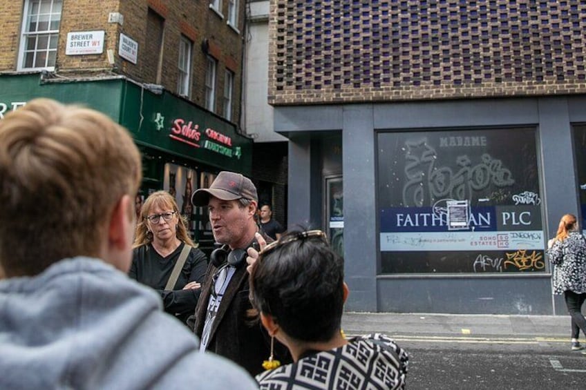 A street scene with people gathered, a building with a sign that reads 'Salisbury,' and another sign that says 'FAITHFUL PLC.' 3