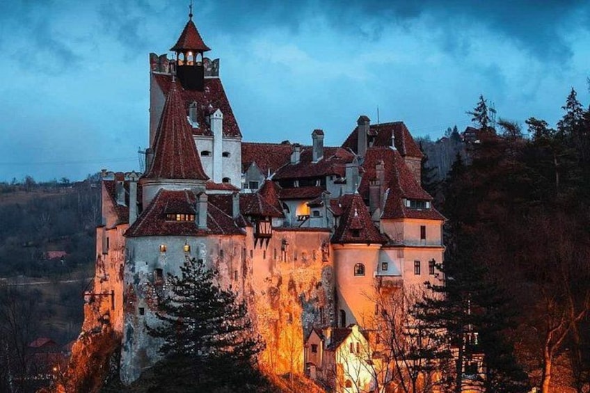 A castle with multiple towers and a steep cliff. 3