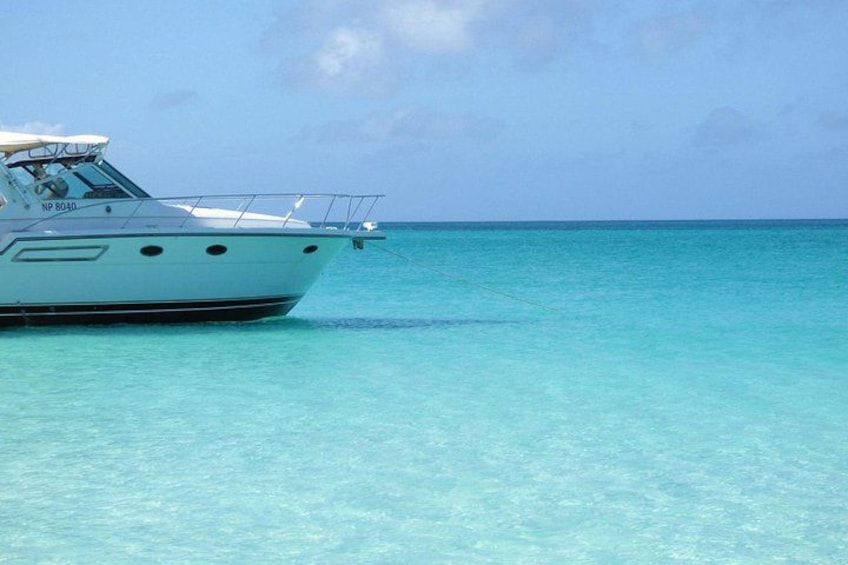 A white boat with the registration number NP 8040 on turquoise water. 4