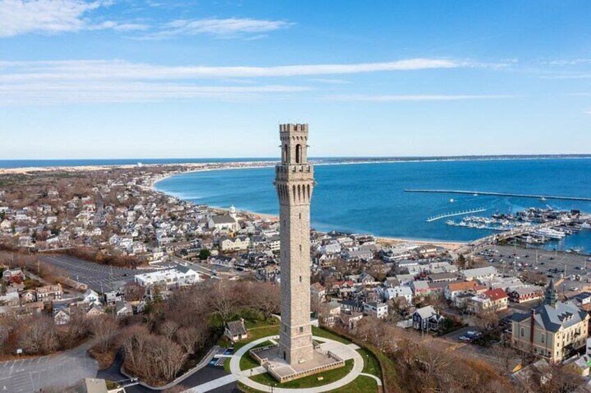 A coastal town with a prominent tower, marina, and residential area. 5