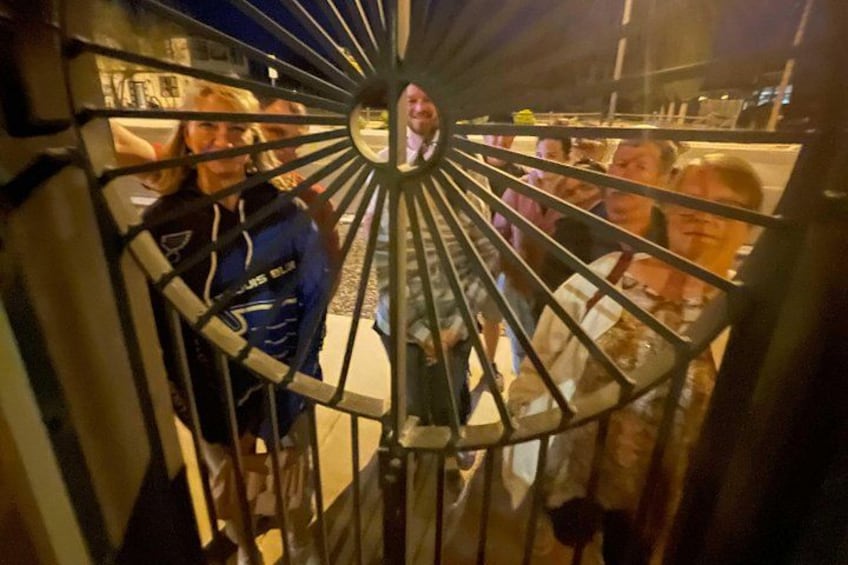 A spiral staircase with a person standing on the upper level. 4