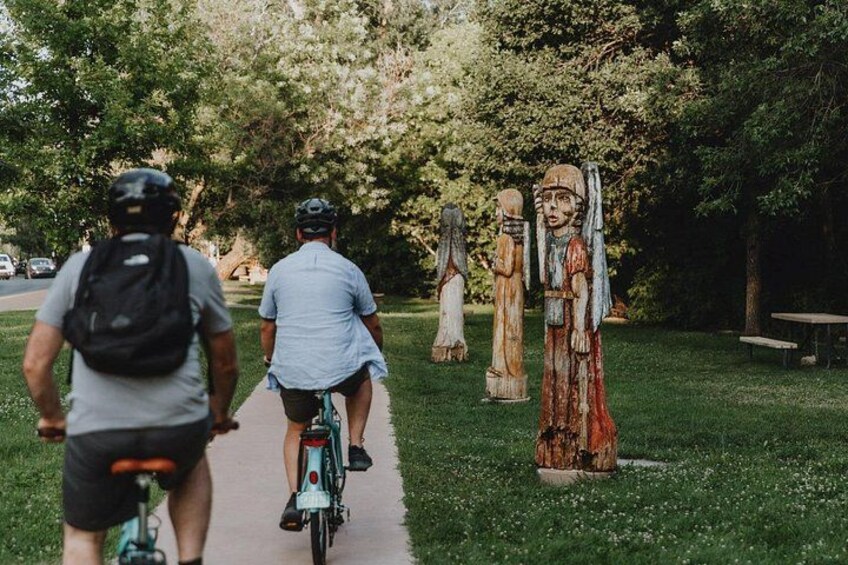 Cruising along Alameda Street admiring cottonwood sculptures. 4
