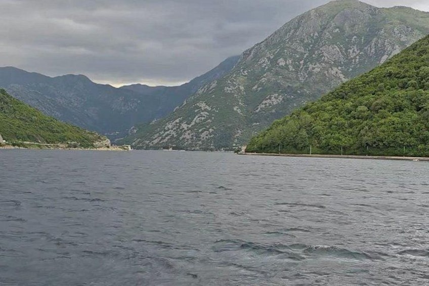 A lake surrounded by mountains. 2