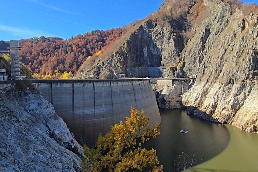 A dam, a river, and a mountainous landscape. 2