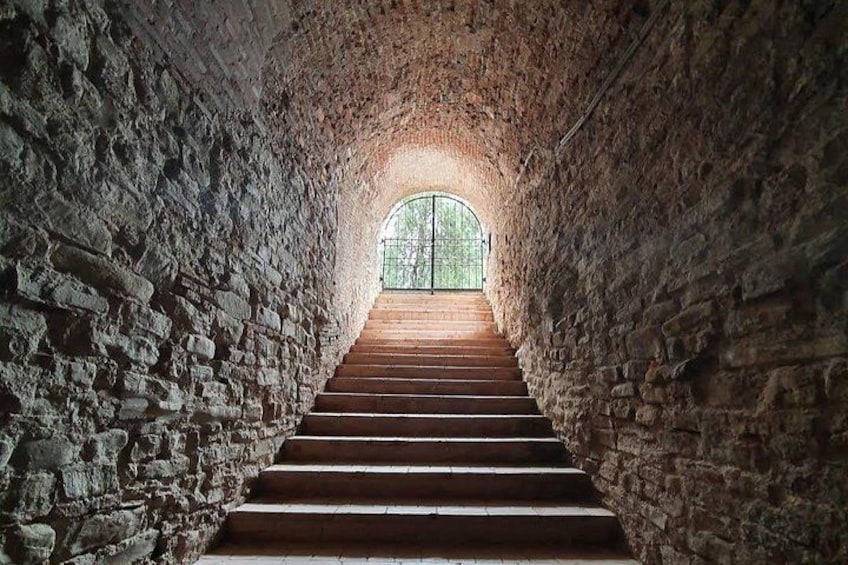 A stone staircase leading to a window. 4