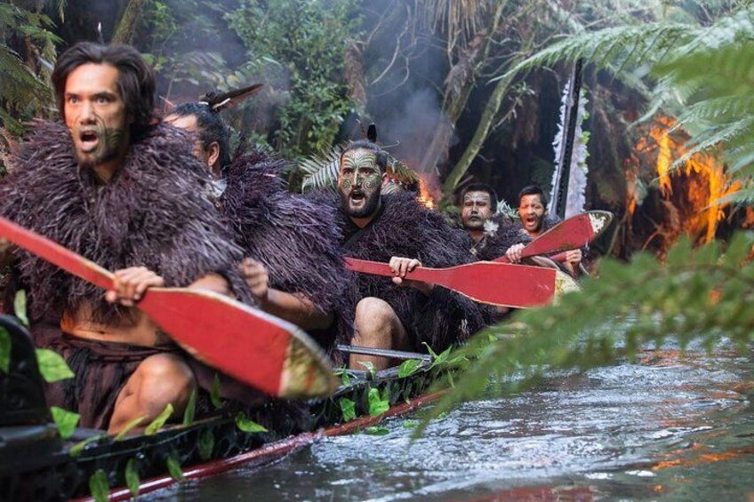 Warriors paddling the ancient war canoe 3