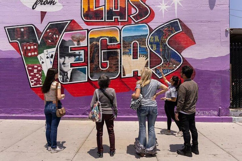 A mural with the text 'from LAS VEGAS' and various playing card suits. 2