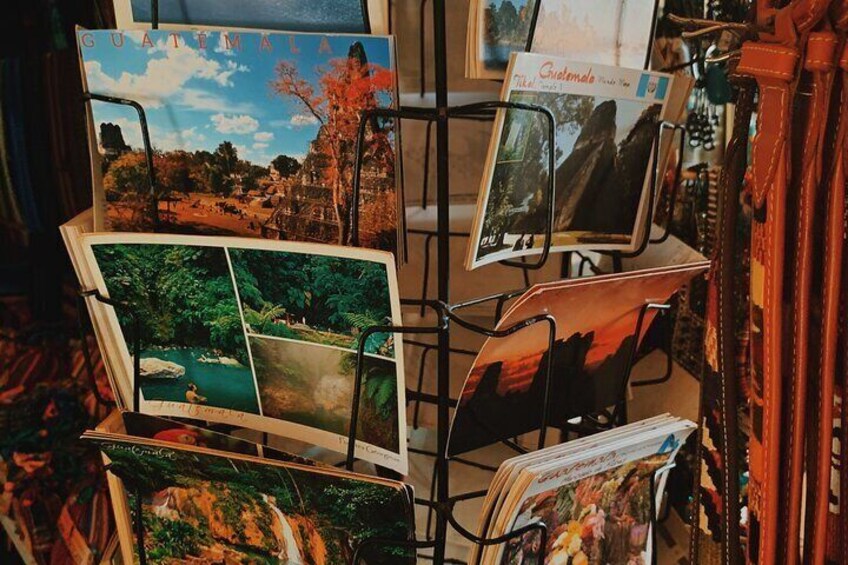 A display of travel postcards with various scenic landscapes. 1