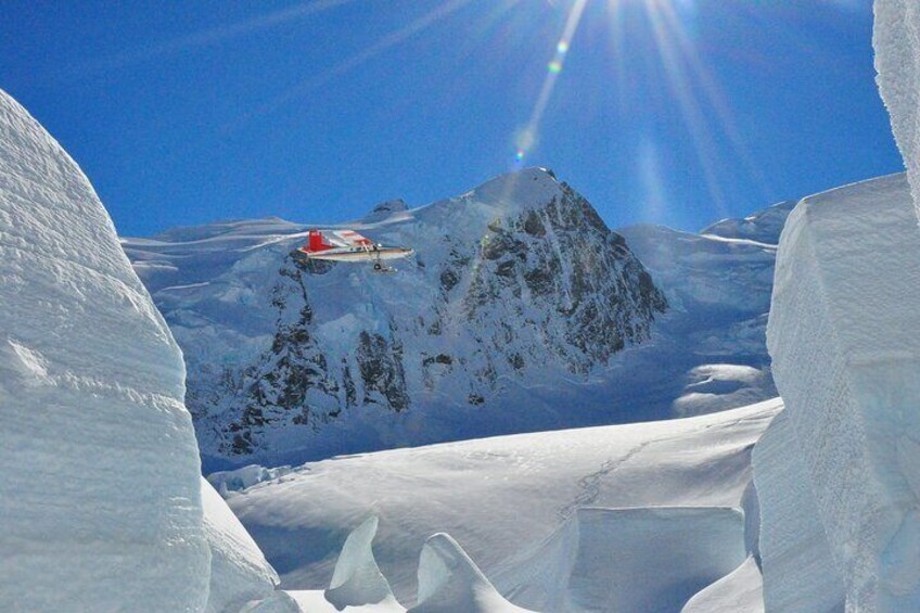 A snow-covered mountain with a ski lift in the background. 4