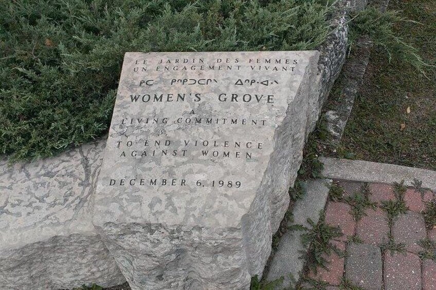 A stone monument with inscriptions commemorating the Women's Grove, a living commitment to end violence against women, dated December 6, 1989. 2