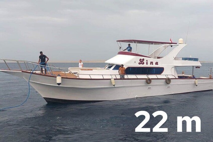A white boat with the name 'Lina' on the side, marked as 22 meters in length. 5