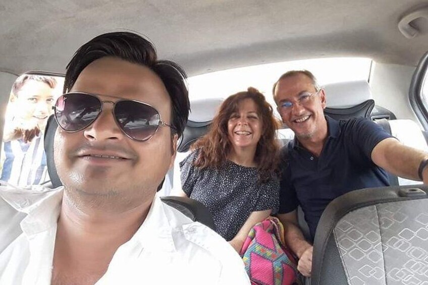 A car interior with three passengers. 1