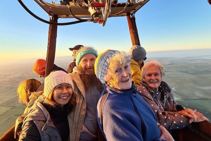 A group of people in a vehicle with a clear view of the landscape. 5