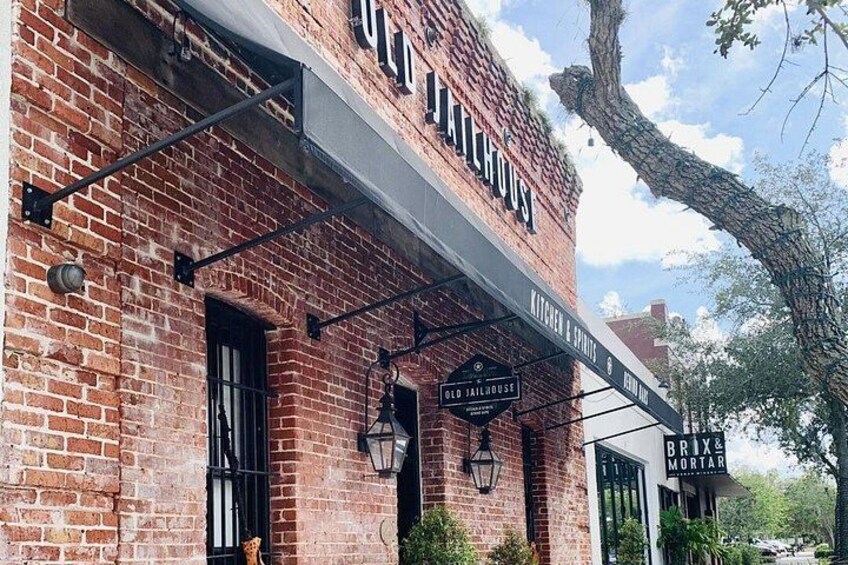 A brick building with a sign that reads 'Old Jailhouse.' 2