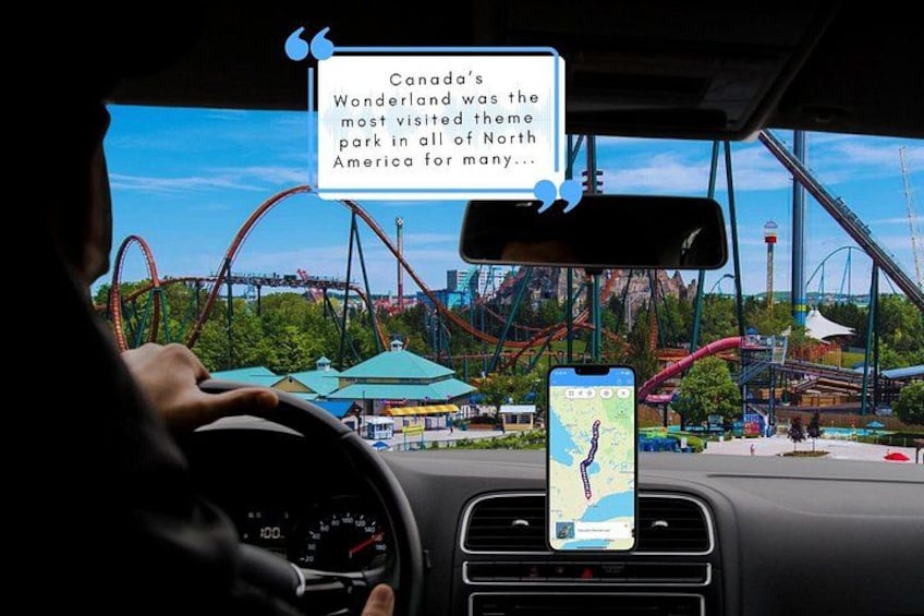 A person driving with a smartphone mounted on the dashboard, a view of a theme park with roller coasters, and a quote about Canada's Wonderland. 1