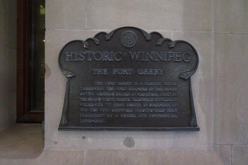 A plaque on a building wall. 2