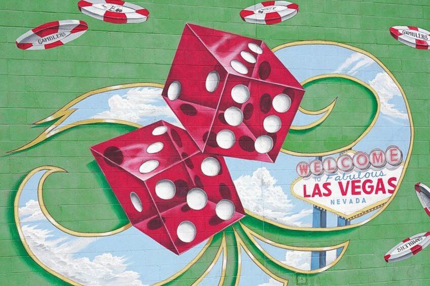 A wall with a 'Welcome to Fabulous Las Vegas Nevada' sign, dice, and lifebuoys. 3
