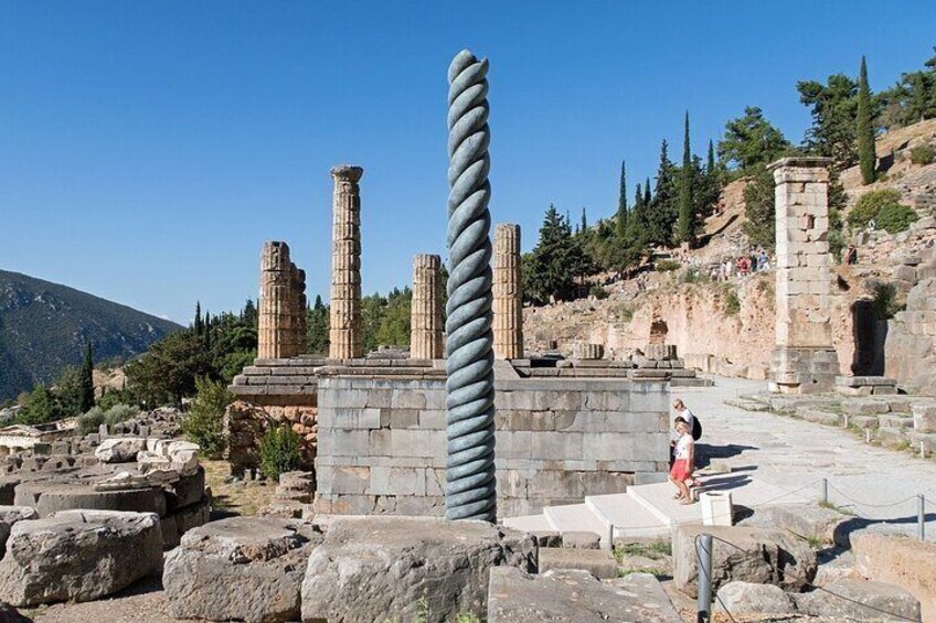 Ancient ruins with columns and stone structures. 1