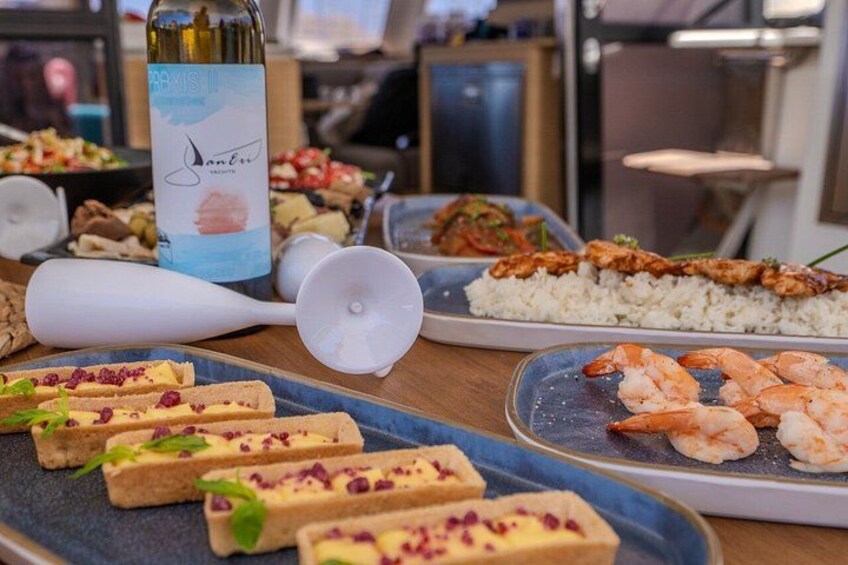 A table with various dishes, including shrimp, rice, and bread. 3