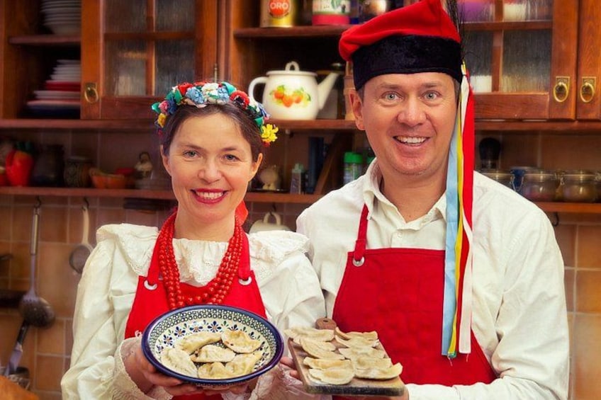A person holding a bowl of food and another person with a tray of food. 1