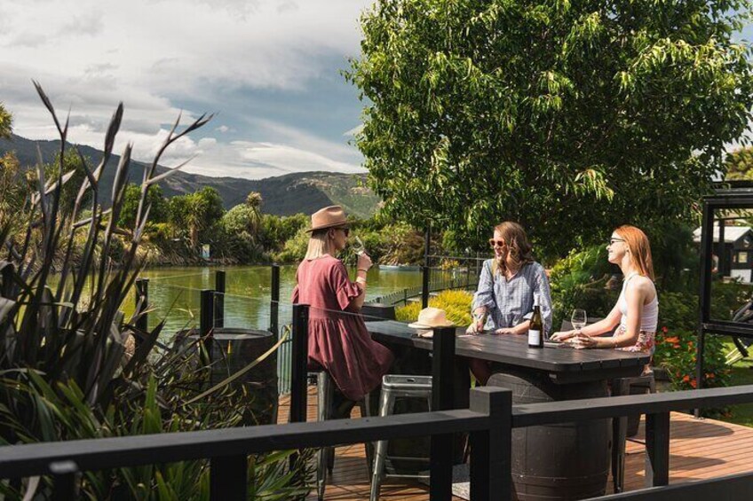 Friends tasting wine at cellar door in Marlborough