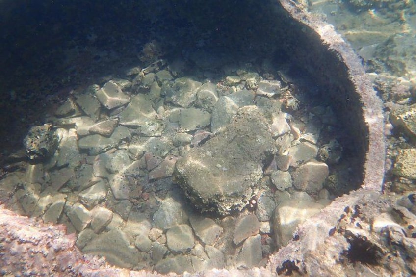 A rocky underwater landscape with clear water. 3