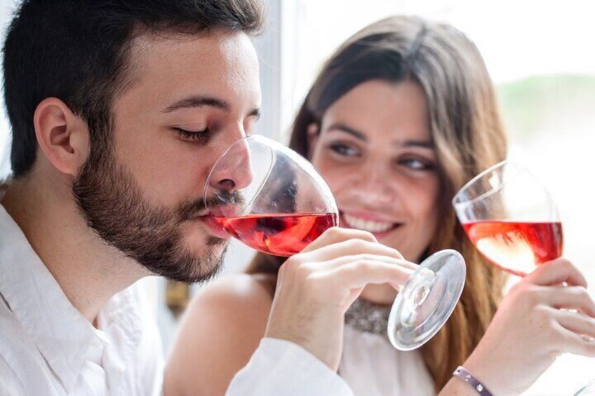 Two people holding wine glasses. 2